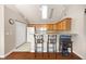 Kitchen showcasing the breakfast bar, appliances, and wooden cabinets at 5069 Kathryn Glen Dr, Acworth, GA 30101