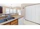Kitchen featuring an island with granite countertops and a stainless steel sink at 5069 Kathryn Glen Dr, Acworth, GA 30101