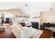 Bright living room with hardwood floors, fireplace, ceiling fan, and elegant furnishings at 5069 Kathryn Glen Dr, Acworth, GA 30101