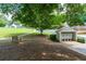 Community mailboxes beside a sidewalk with benches, mature trees, and well-maintained landscaping at 5069 Kathryn Glen Dr, Acworth, GA 30101