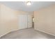 Bedroom featuring neutral walls, carpet flooring and a closet at 1765 Redbud Way, Cumming, GA 30041