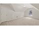 Bonus room with a neutral carpet, a window to the outside, and a utility closet at 1765 Redbud Way, Cumming, GA 30041