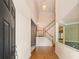 Bright entryway with hardwood floors, staircase, and soaring ceilings provides a welcoming entrance at 1765 Redbud Way, Cumming, GA 30041