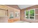 Bright living room offering great natural light, a view of the upstairs, and access to the formal dining room at 1765 Redbud Way, Cumming, GA 30041