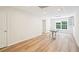 Finished basement featuring wood flooring, white doors and table at 2359 Saint Kennedy Ln, Buford, GA 30518