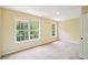 Bright bedroom featuring two large windows and neutral paint at 2359 Saint Kennedy Ln, Buford, GA 30518