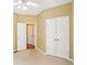 Bedroom with carpet flooring, closet, neutral walls and doors at 2359 Saint Kennedy Ln, Buford, GA 30518
