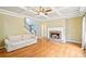 The living room features a cozy fireplace, hardwood floors, and trey ceilings at 2359 Saint Kennedy Ln, Buford, GA 30518