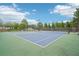 Outdoor tennis court at Windsor community features well maintained courts and professional netting at 2359 Saint Kennedy Ln, Buford, GA 30518
