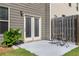 Cozy back patio with room for seating, accessed by double doors at 2829 Wild Laurel Ct, Norcross, GA 30071