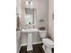 Powder room with pedestal sink and decorative accents at 2829 Wild Laurel Ct, Norcross, GA 30071