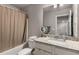 Bathroom featuring a tub with shower and granite countertop offering functionality and style at 2829 Wild Laurel Ct, Norcross, GA 30071