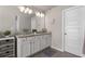 Bathroom with double sinks and granite countertops offers space and style, featuring modern lighting fixtures at 2829 Wild Laurel Ct, Norcross, GA 30071