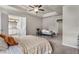 Bedroom with a tray ceiling, leading to a Primary bathroom, providing a luxurious retreat at 2829 Wild Laurel Ct, Norcross, GA 30071