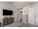 Cozy bedroom featuring a mounted TV and storage drawers, perfect for relaxation and organization at 2829 Wild Laurel Ct, Norcross, GA 30071