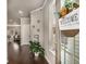 Inviting foyer with hardwood floors, a welcome sign, and natural light streaming through the window at 2829 Wild Laurel Ct, Norcross, GA 30071