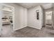 Hallway with neutral carpet connecting to the bedroom and bathroom, providing a seamless flow at 2829 Wild Laurel Ct, Norcross, GA 30071