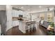 Modern kitchen featuring white cabinets, stainless steel appliances, and a spacious island with seating at 2829 Wild Laurel Ct, Norcross, GA 30071