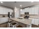 Modern kitchen with white cabinets, stainless steel appliances, and a large center island at 2829 Wild Laurel Ct, Norcross, GA 30071