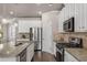 Bright kitchen with stainless steel appliances, granite countertops, and white cabinetry at 2829 Wild Laurel Ct, Norcross, GA 30071