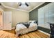 This bedroom has hardwood floors, natural light, and neutral walls at 3777 Peachtree Ne Rd # 438, Brookhaven, GA 30319