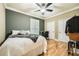 This bedroom features stylish wall colors, wooden floor, and a ceiling fan at 3777 Peachtree Ne Rd # 438, Brookhaven, GA 30319