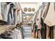 This large walk-in closet provides ample storage with shelves and clothing racks at 3777 Peachtree Ne Rd # 438, Brookhaven, GA 30319