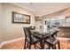 Dining room featuring hardwood floors and a glass table that looks into the kitchen at 3777 Peachtree Ne Rd # 438, Brookhaven, GA 30319