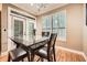 Bright dining room with table, hardwood floors, and white-shuttered windows at 3777 Peachtree Ne Rd # 438, Brookhaven, GA 30319