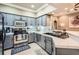 Stylish gray kitchen featuring modern appliances, subway tile backsplash, and marble counters at 3777 Peachtree Ne Rd # 438, Brookhaven, GA 30319