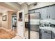 Gray painted cabinets accent this kitchen featuring stainless steel appliances and white subway tile backsplash at 3777 Peachtree Ne Rd # 438, Brookhaven, GA 30319