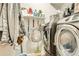This laundry room features a side by side washer and dryer and storage at 3777 Peachtree Ne Rd # 438, Brookhaven, GA 30319
