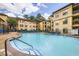 This pool area features lounge chairs, a pool, and an apartment building at 3777 Peachtree Ne Rd # 438, Brookhaven, GA 30319