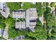 Aerial view of townhomes showcasing roof lines and mature surrounding trees at 1325 Oakview Rd, Decatur, GA 30030
