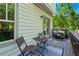 This home's balcony offers a peaceful retreat with comfortable seating and views of nature at 1325 Oakview Rd, Decatur, GA 30030