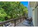 Enjoy outdoor living on this home's balcony, surrounded by mature trees and lush foliage at 1325 Oakview Rd, Decatur, GA 30030