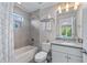 Well-lit bathroom featuring tile shower, granite countertop vanity, and decorative towel rack at 1325 Oakview Rd, Decatur, GA 30030