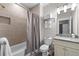 Modern bathroom with tile surround tub and granite vanity at 1325 Oakview Rd, Decatur, GA 30030