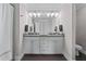 Bathroom featuring a double vanity with granite countertop, and modern lighting at 1325 Oakview Rd, Decatur, GA 30030