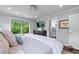 Bright bedroom featuring a window, dresser, and ensuite bathroom at 1325 Oakview Rd, Decatur, GA 30030