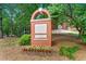 Charming brick sign marking the entrance to Agnes Scott College, adorned with flowers and greenery at 1325 Oakview Rd, Decatur, GA 30030