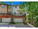 Townhome with a private deck, an attached garage, and a brick foundation at 1325 Oakview Rd, Decatur, GA 30030