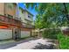 Townhome with a private deck, an attached garage, and a brick foundation in daylight at 1325 Oakview Rd, Decatur, GA 30030