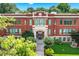 Kirkwood School with a beautiful brick facade, symmetrical design, and lush green landscaping in front at 1325 Oakview Rd, Decatur, GA 30030