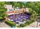 Universal Joint with lively outdoor patio, shaded seating, colorful umbrellas, and unique building facade at 1325 Oakview Rd, Decatur, GA 30030