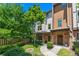 Charming townhome with brick accents, lush landscaping, and a welcoming front yard at 1325 Oakview Rd, Decatur, GA 30030