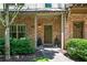 Inviting brick porch with stylish front door and manicured shrubs at 1325 Oakview Rd, Decatur, GA 30030