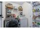 Functional laundry room with washer, dryer, shelving, and ample storage space at 1325 Oakview Rd, Decatur, GA 30030