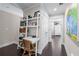 Hallway featuring a built-in shelving unit, desk, and decorative touches at 1325 Oakview Rd, Decatur, GA 30030