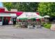 Outdoor seating area in front of Paolino Italian Restaurant, featuring charming tables and umbrellas at 1325 Oakview Rd, Decatur, GA 30030
